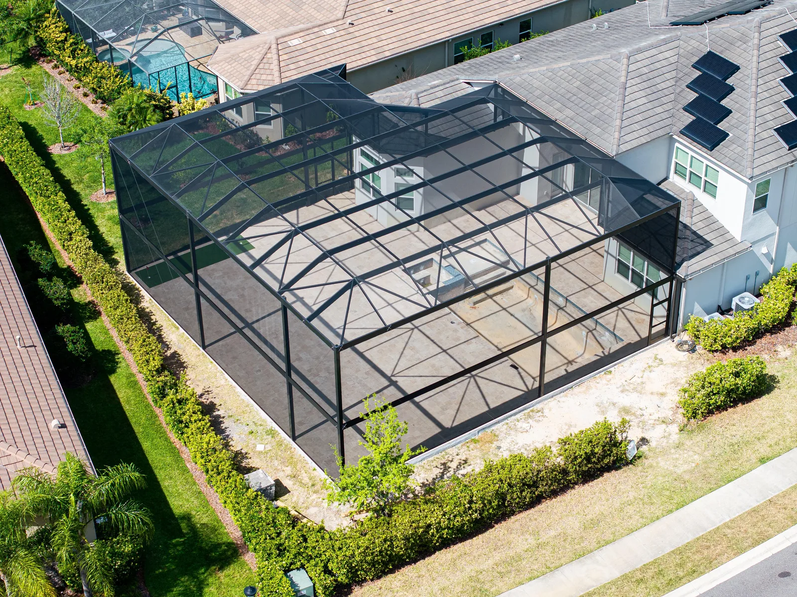 Aerial view of custom aluminum pool cage installed on Florida home, Southwest Florida
