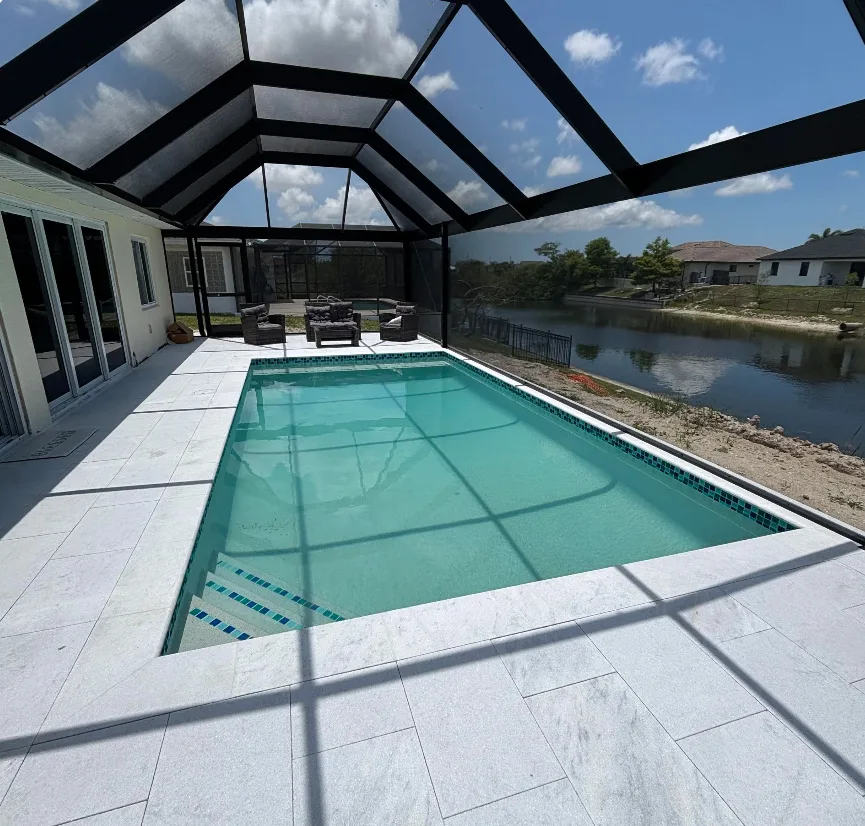 Screened pool cage enclosure on waterfront Florida home