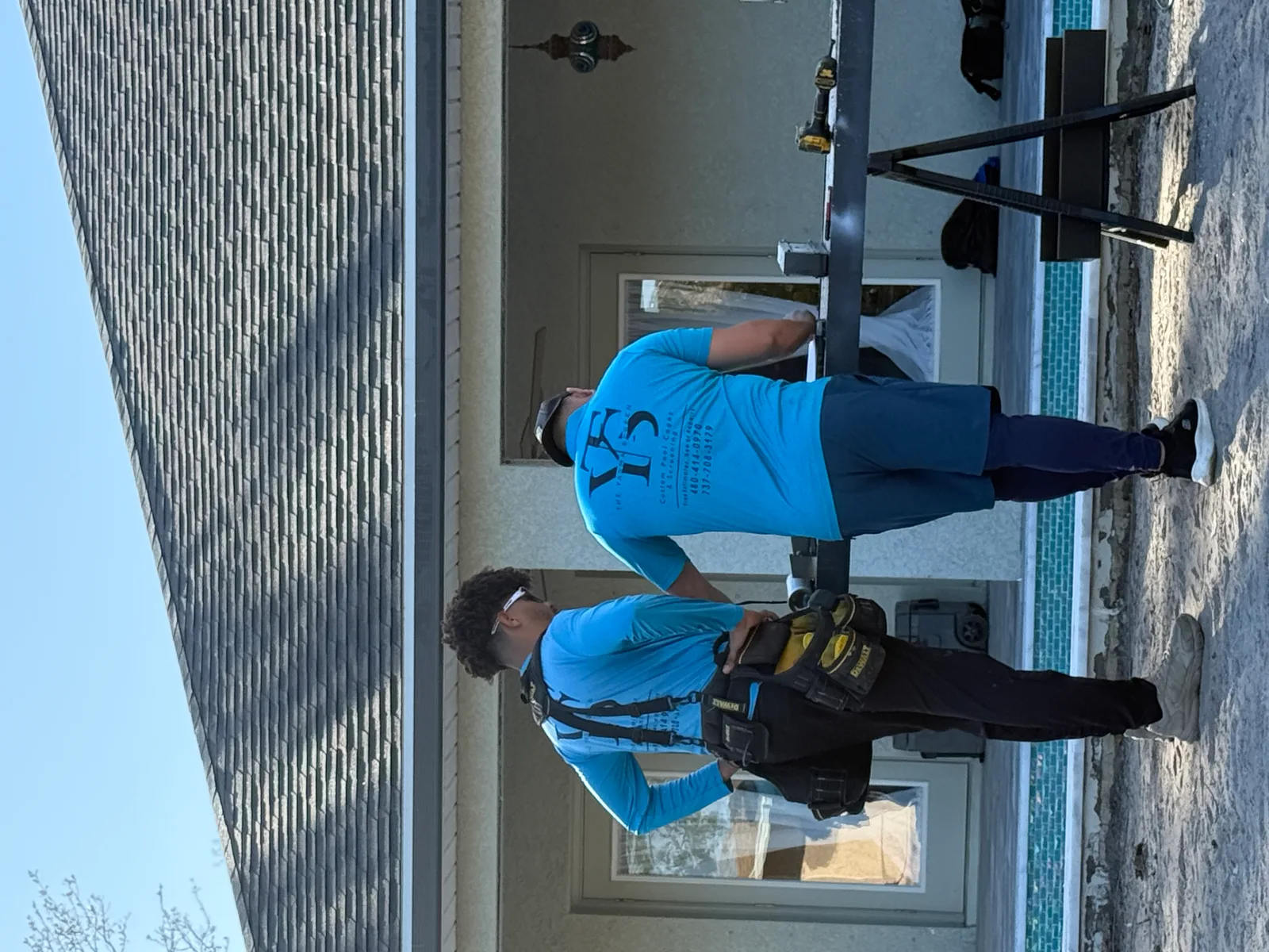 The Yasma Screen crew installing a custom pool cage in Southwest Florida
