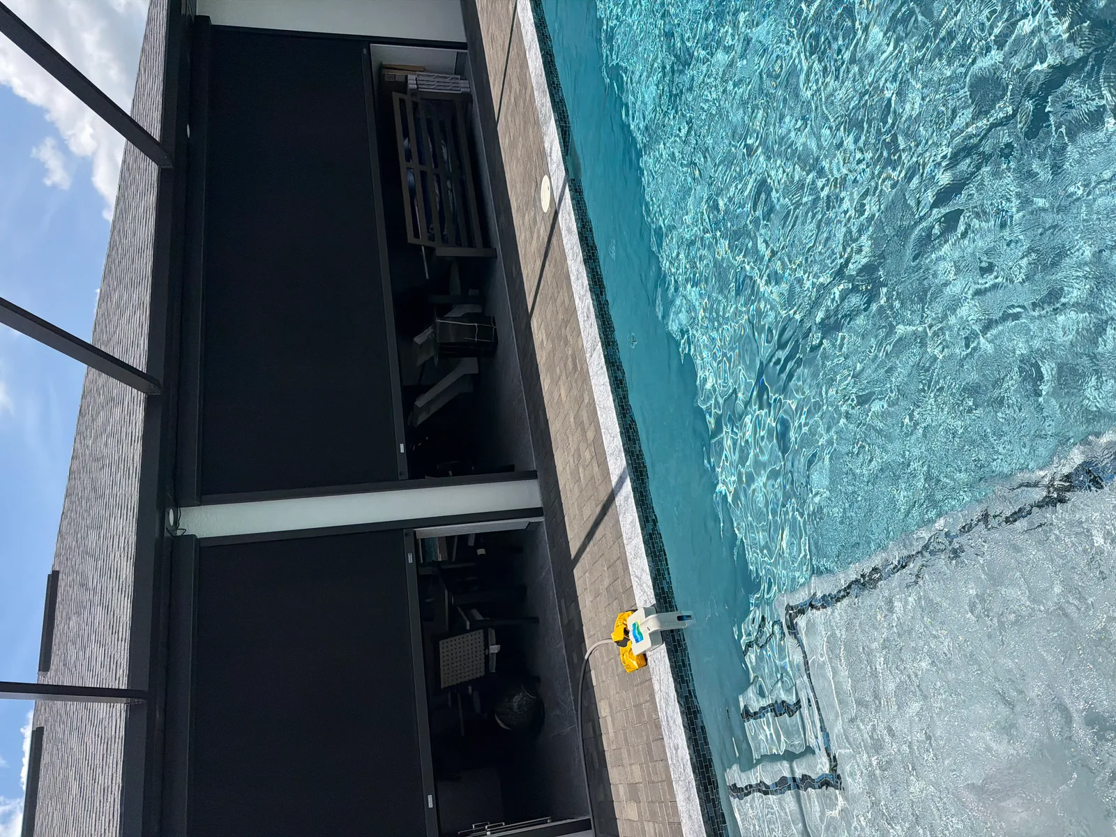 Roll-down hurricane screens installed in a Florida pool enclosure for storm protection