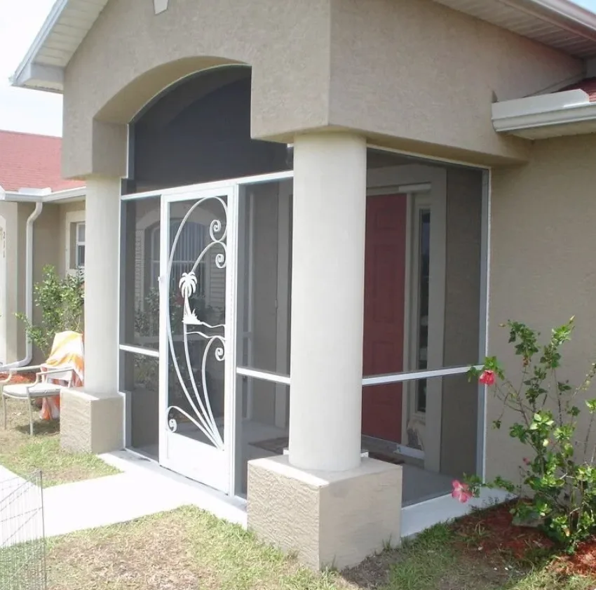 Decorative aluminum entry screen door installed on Florida home